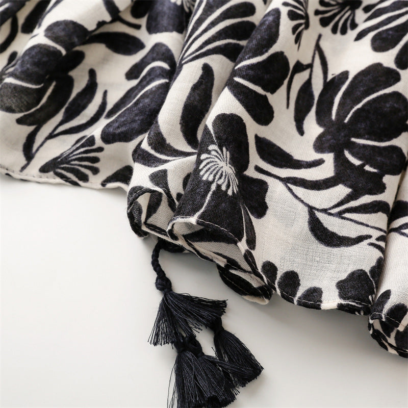 Black flowers print scarf with tassels