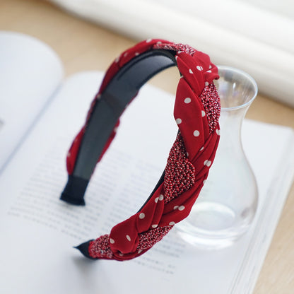 Braided top headband in mixed red polka dots