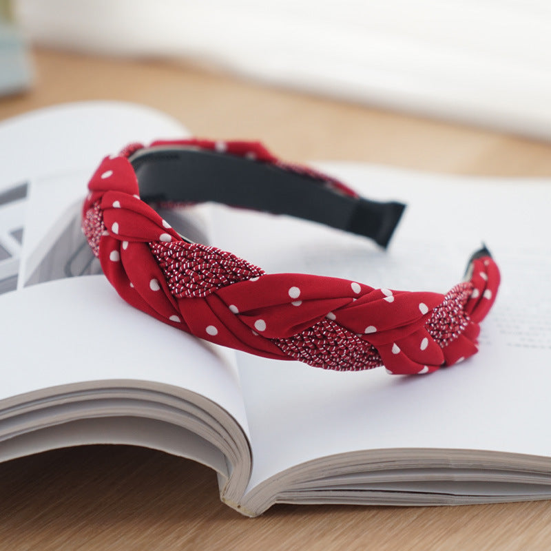 Braided top headband in mixed red polka dots