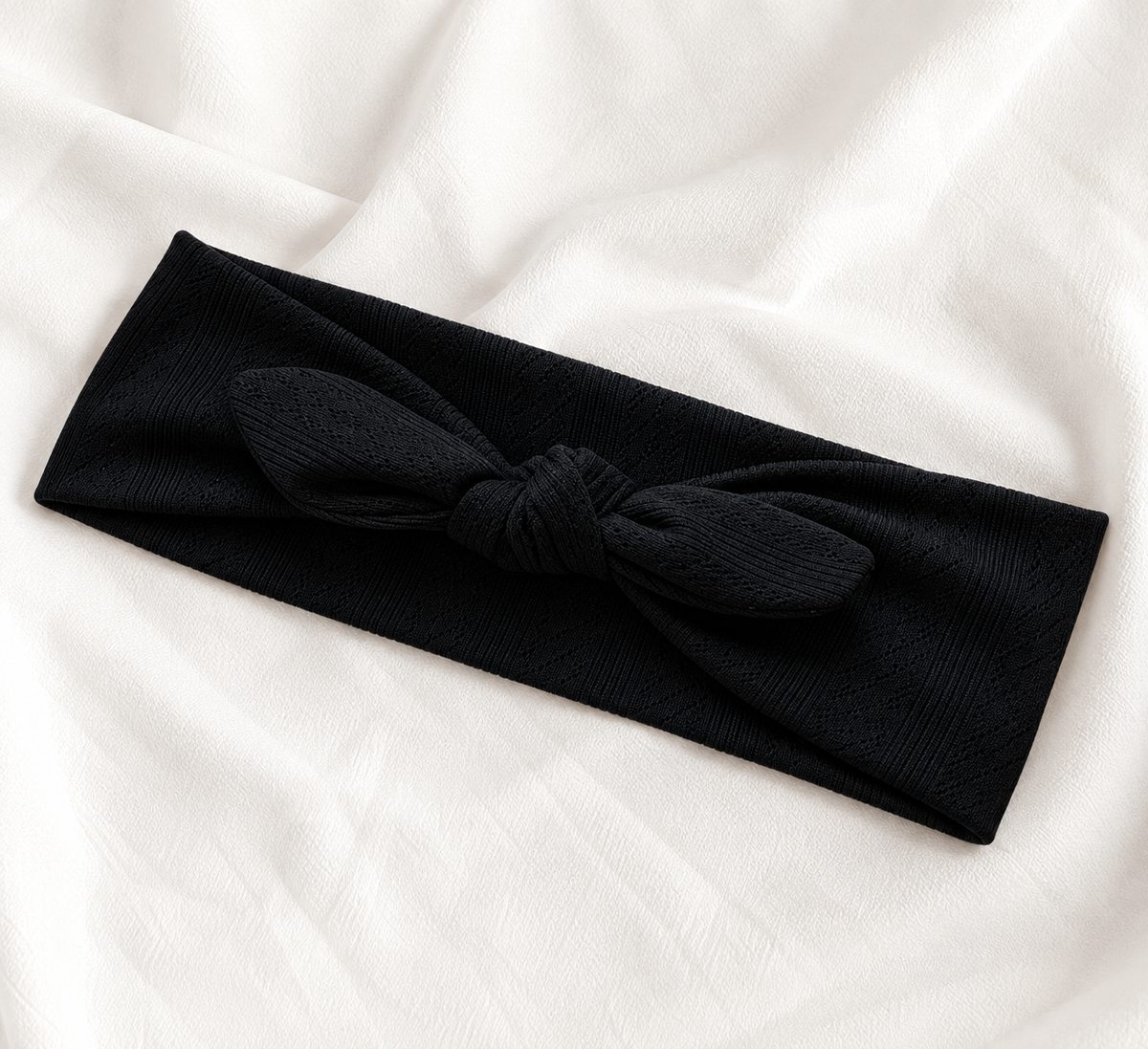 Knitted headband with bow