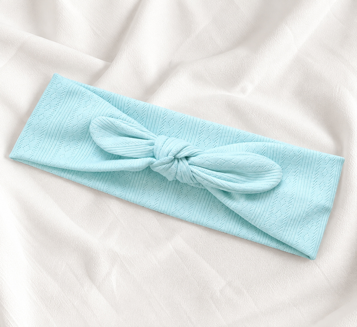 Knitted headband with bow