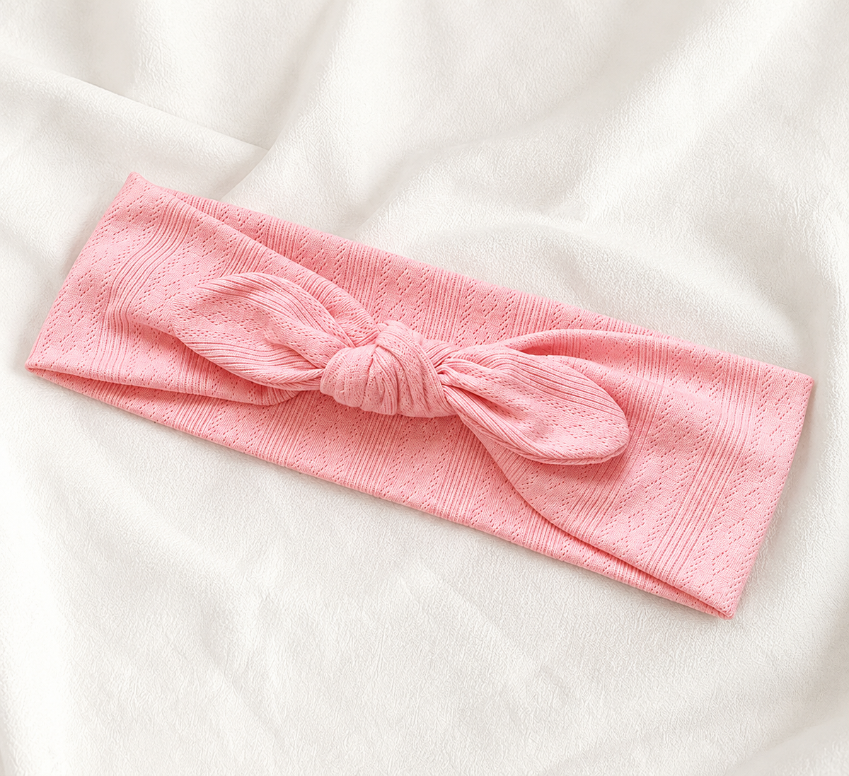 Knitted headband with bow