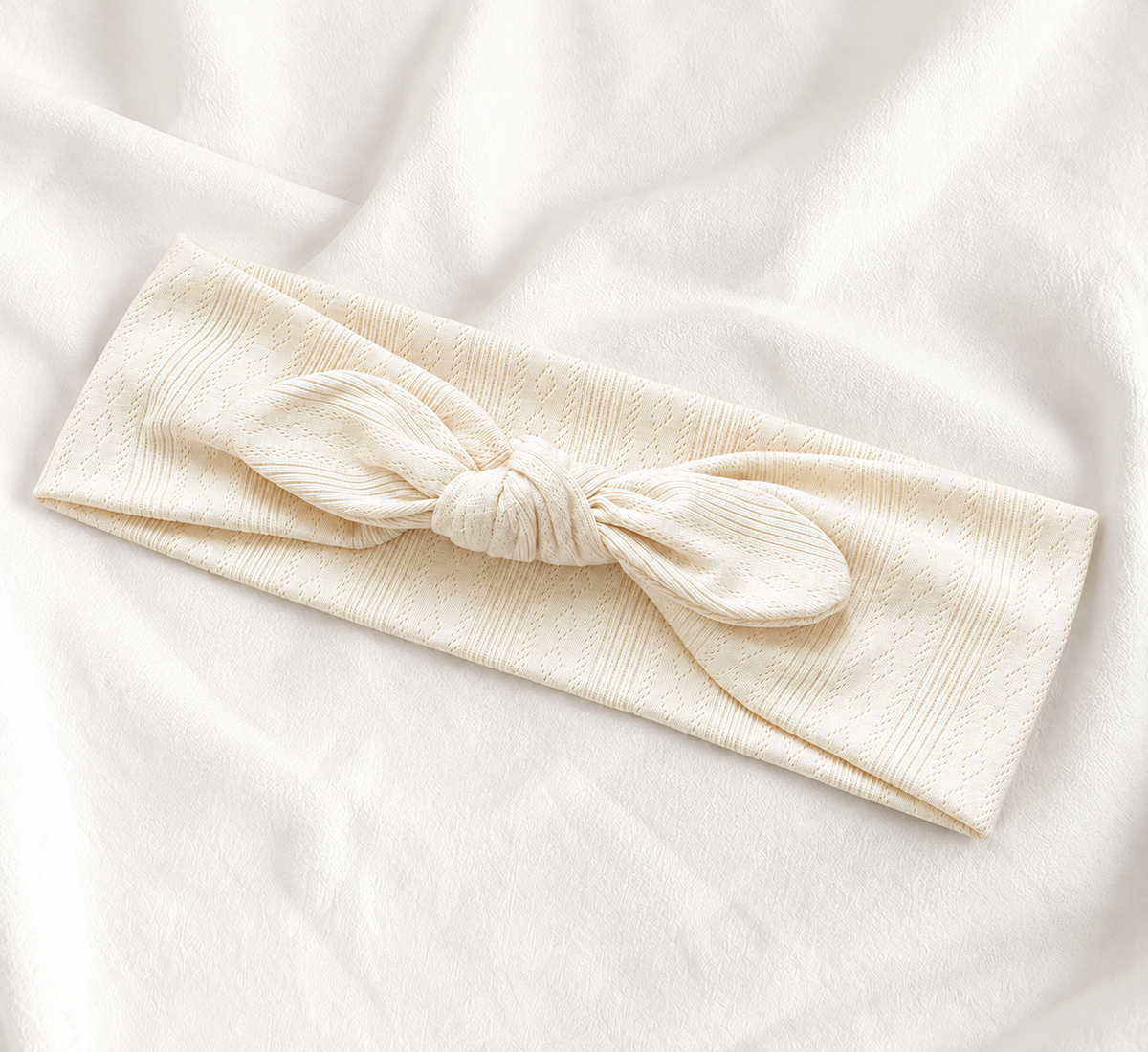 Knitted headband with bow