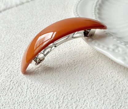 Oval acrylic hair barrette