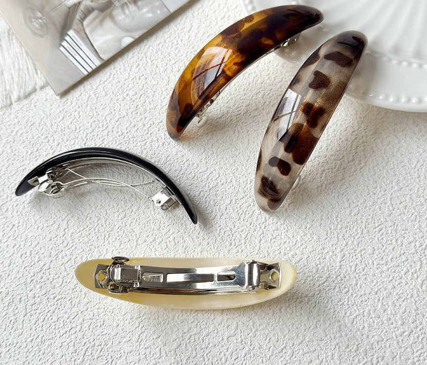 Oval acrylic hair barrette