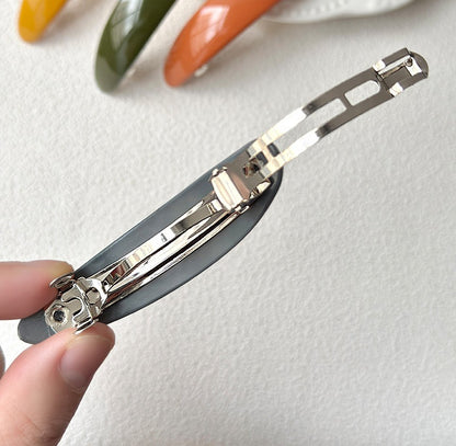 Oval acrylic hair barrette