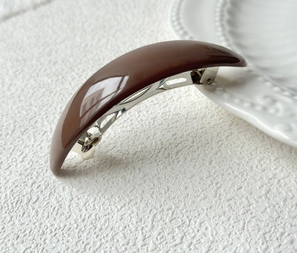 Oval acrylic hair barrette