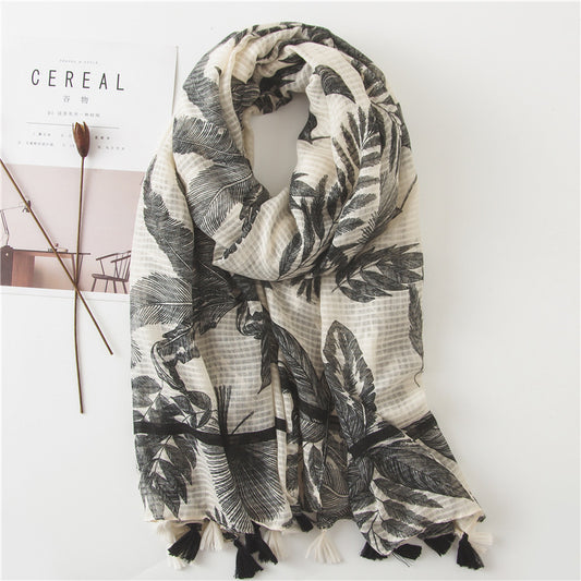 Black large leaves print beige scarf with tassels