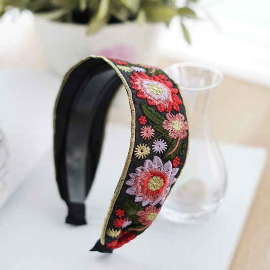 Embroidered flowers on black wide headband