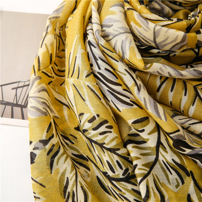 Black leaves print olive yellow scarf with tassels