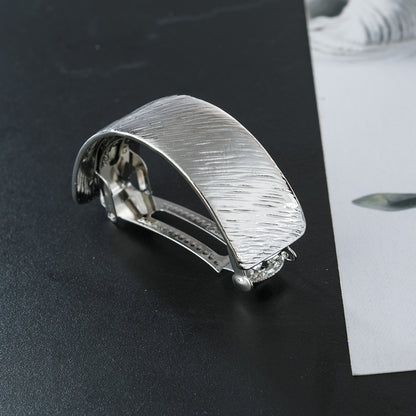 Slim pony tail barrette in brushed metal