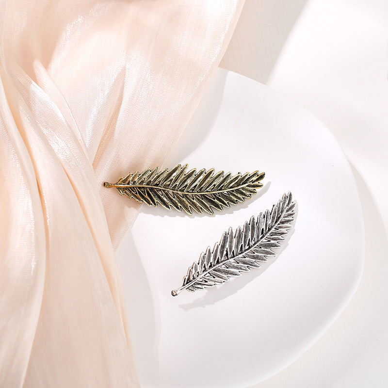 Metallic feather hair barrette
