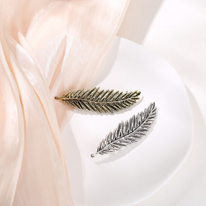Metallic feather hair barrette