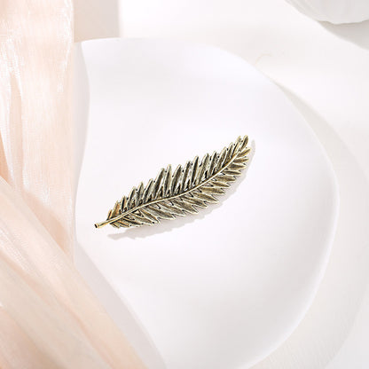 Metallic feather hair barrette