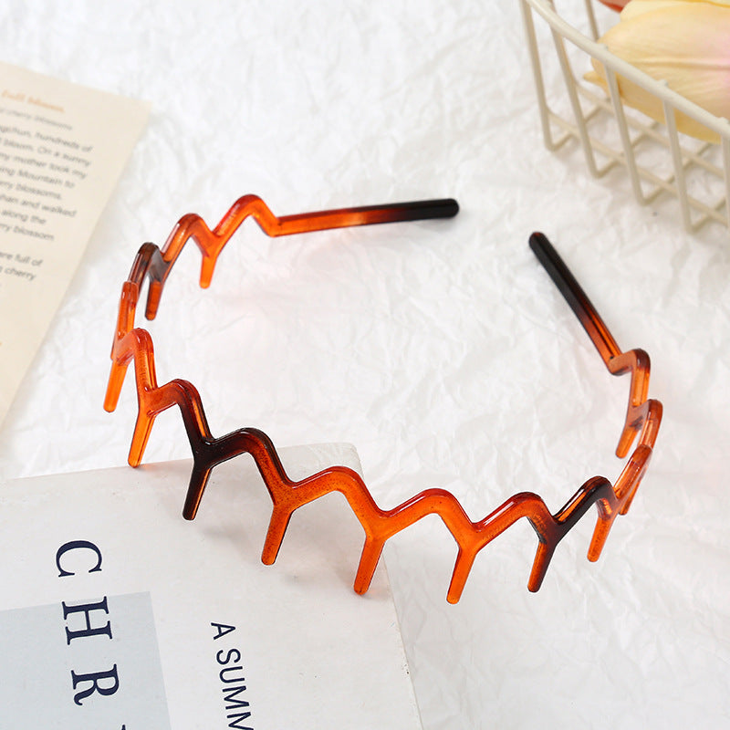 Wavy edge acrylic headband with teeth