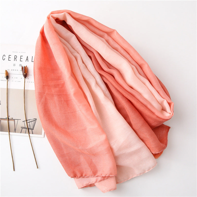 Solid long scarf with tassels in graduated colour pattern