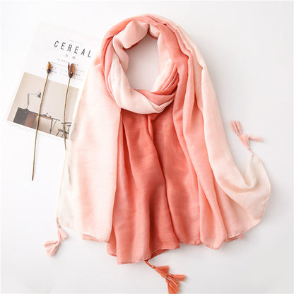 Solid long scarf with tassels in graduated colour pattern