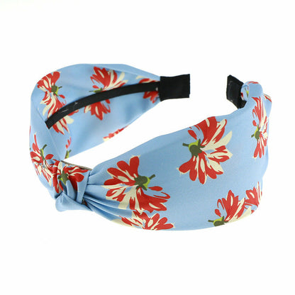 Sky blue knotted headband with red floral print