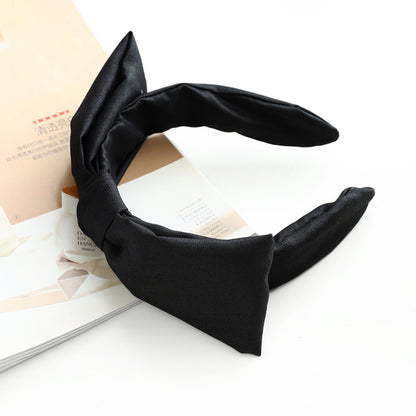 Glossy fabric headband with bow