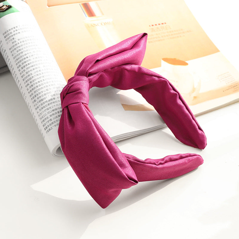 Glossy fabric headband with bow