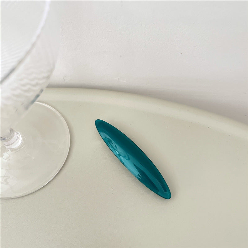 Small long oval resin hair barrette