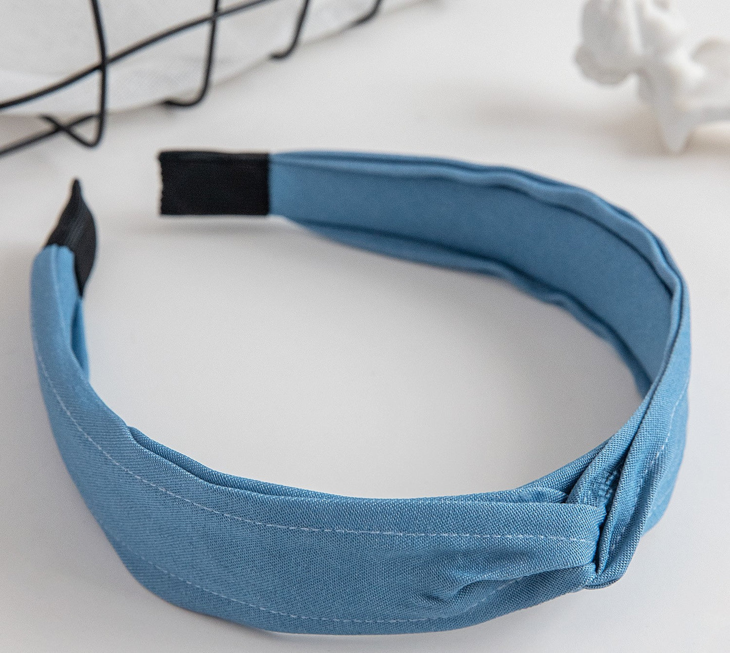 Twist top headband in light denim blue