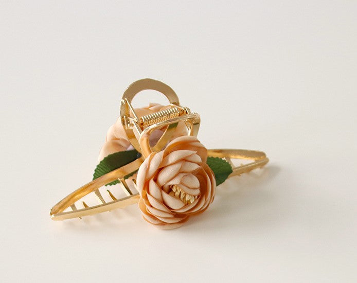 Gold metal hair claw with flowers