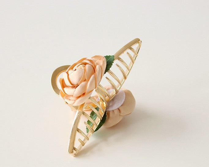 Gold metal hair claw with flowers