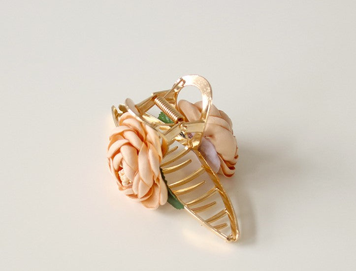 Gold metal hair claw with flowers