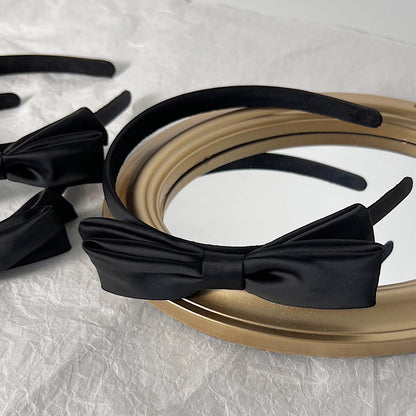 Black silky satin headband with bow